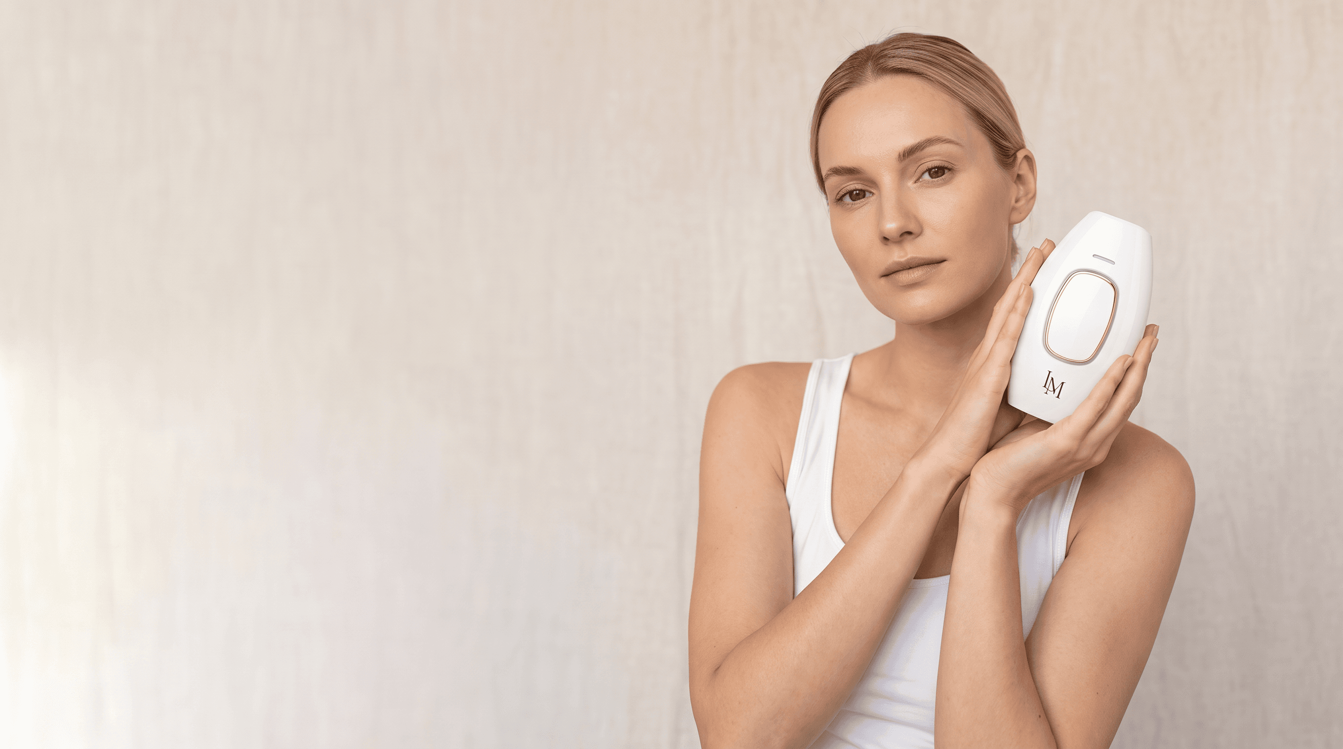 Woman holding Lumimor IPL near her face