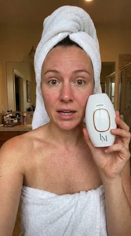 Customer holding Lumimor IPL after shower