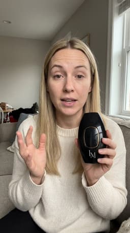 Customer review with black Lumimor IPL on couch